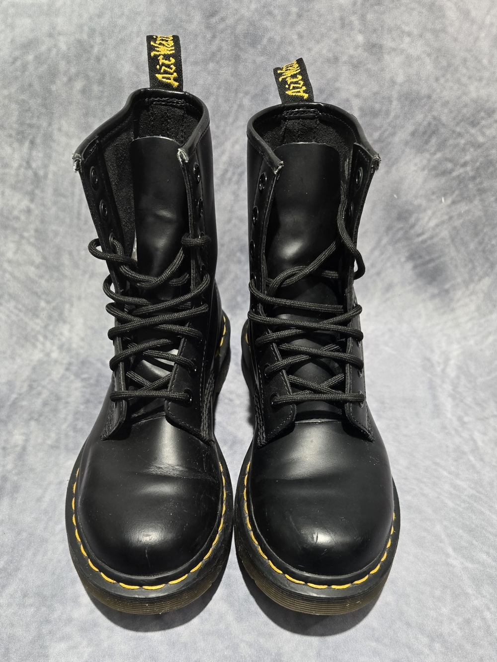 Dr. Martens 1490 Smooth Leather Mid-Calf Boots featuring yellow welt stitching
